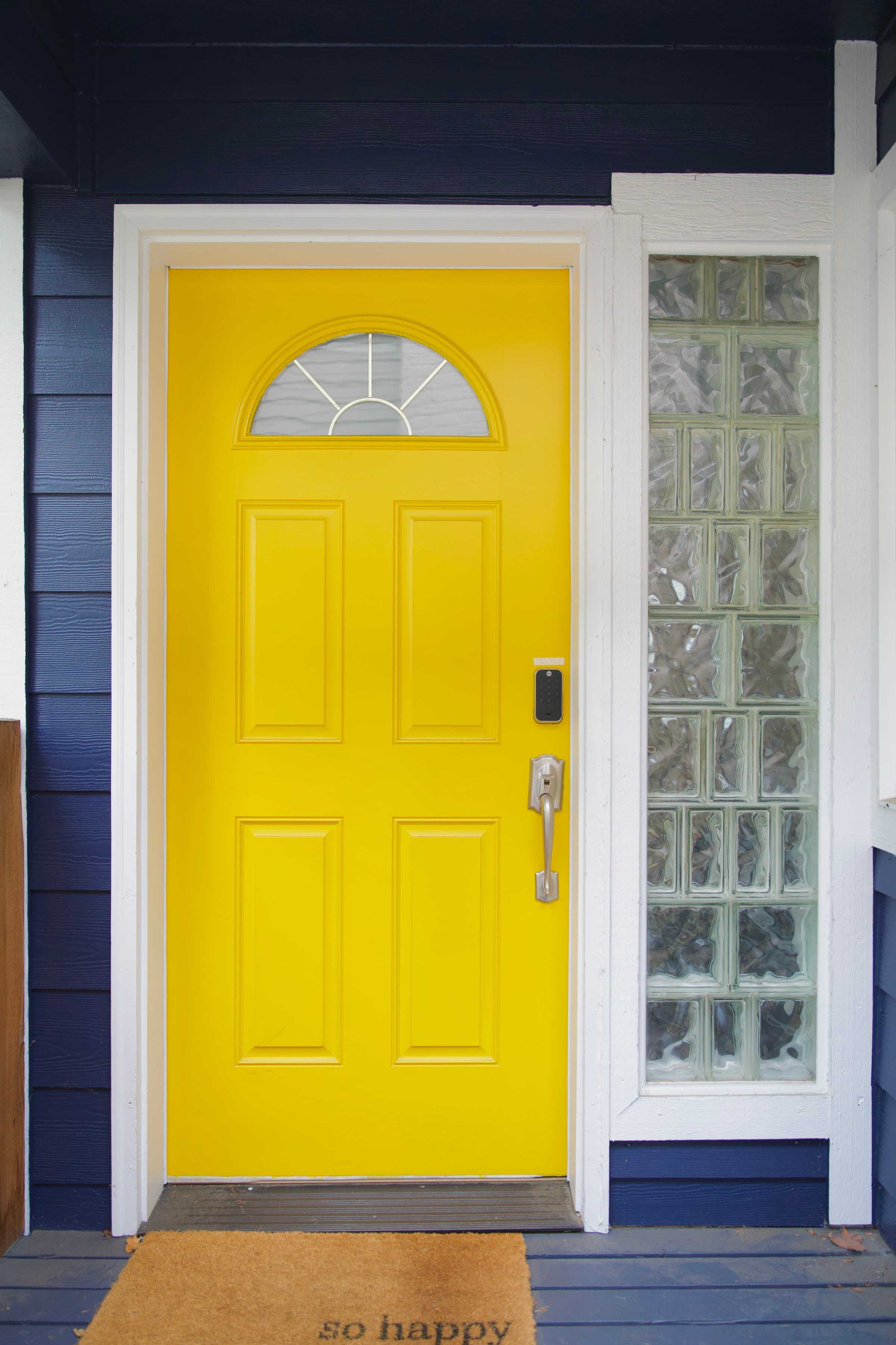 The signature bright yellow front door