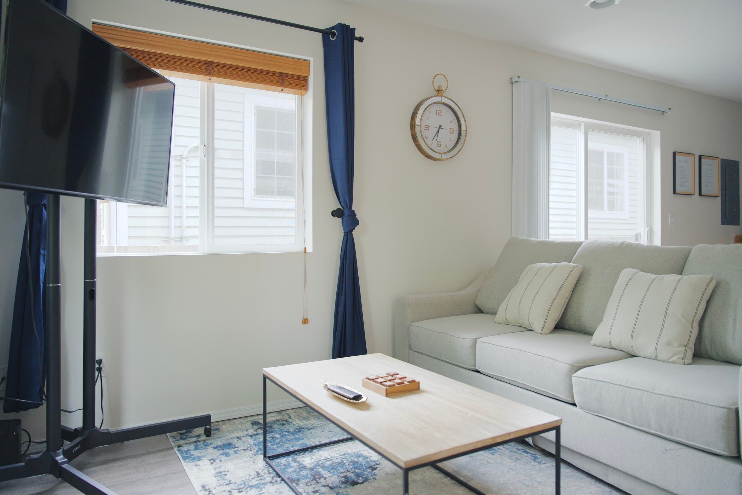 Living room with smart TV and cozy seating