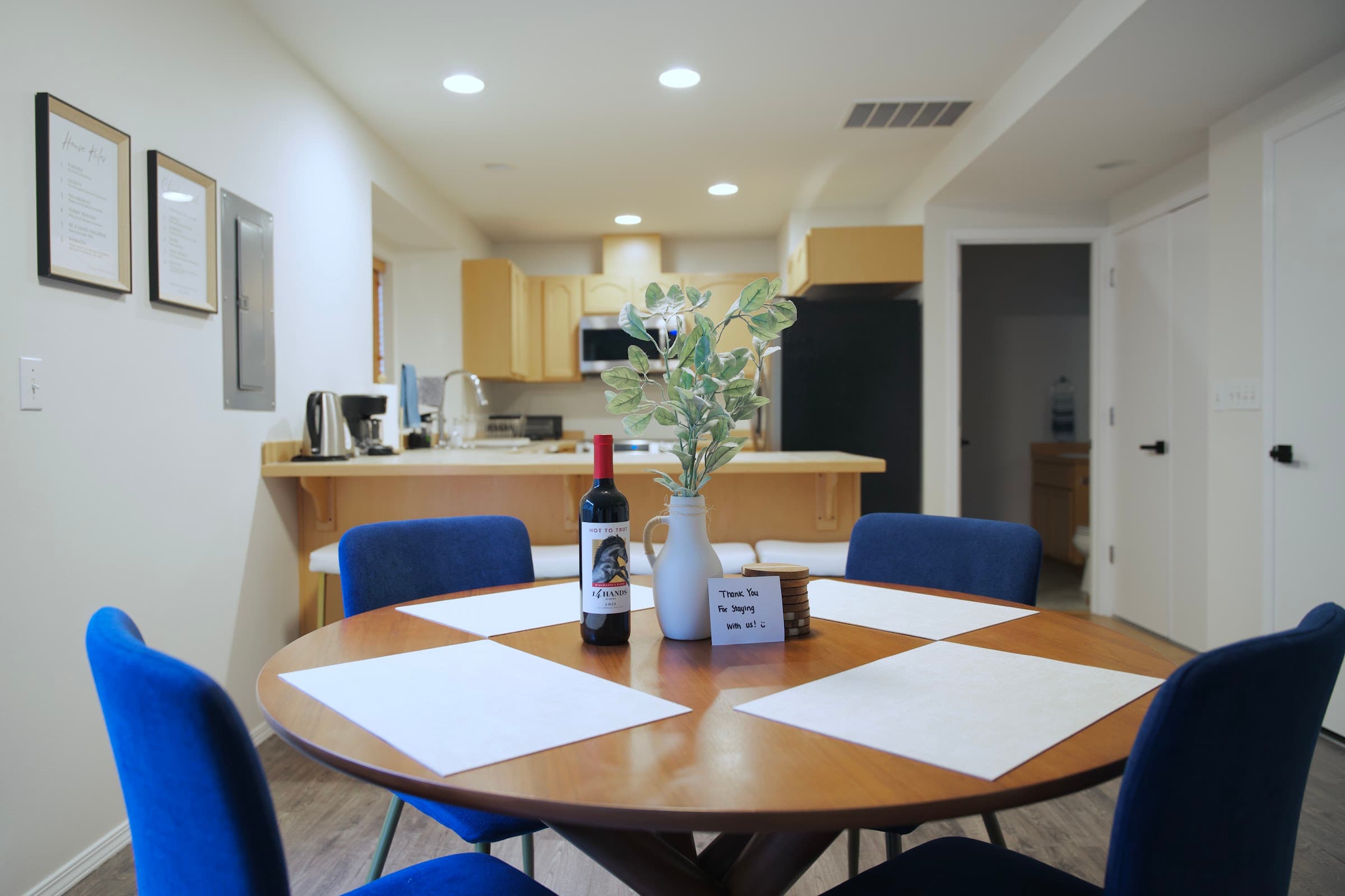 Dining area with round table and blue chairs